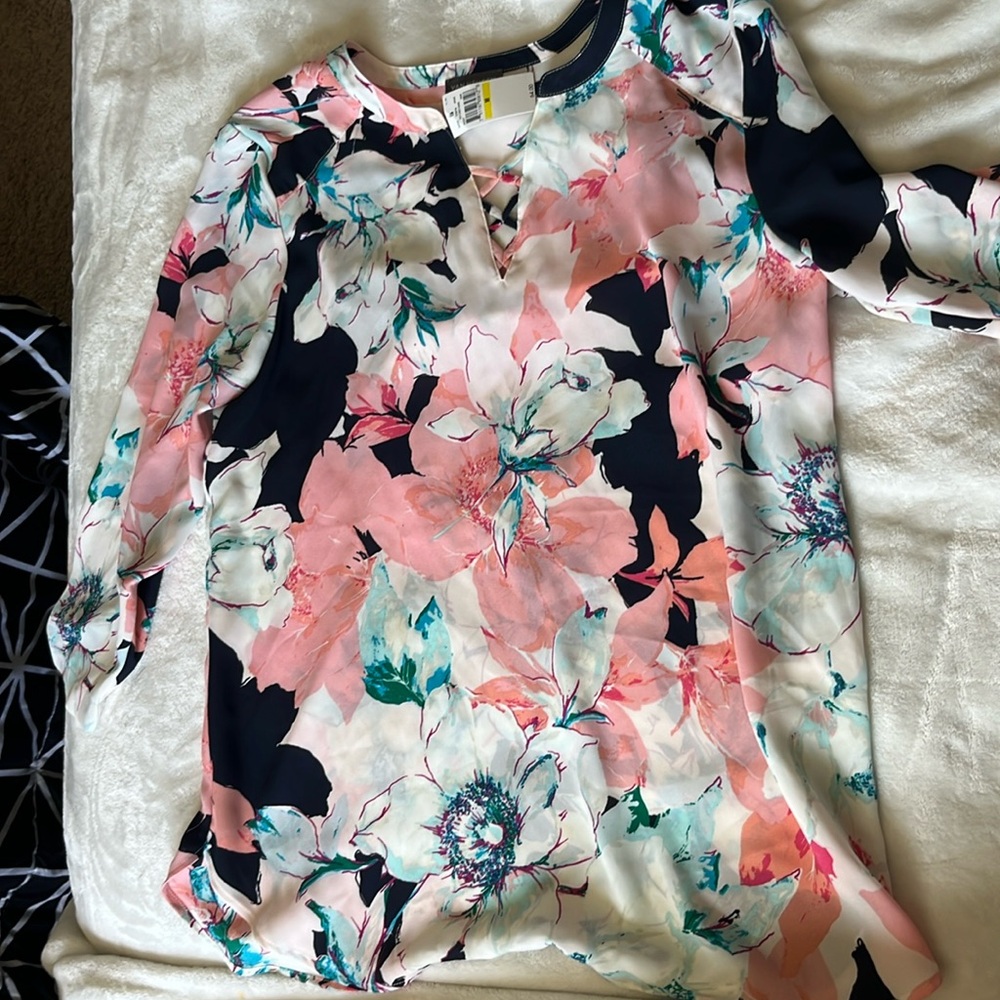 Beautiful work top. New with tags. Hate losing this piece.